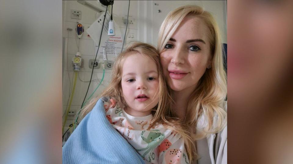 Toddler Ayda pictured in hospital with respiratory nurse, Janet Grace 