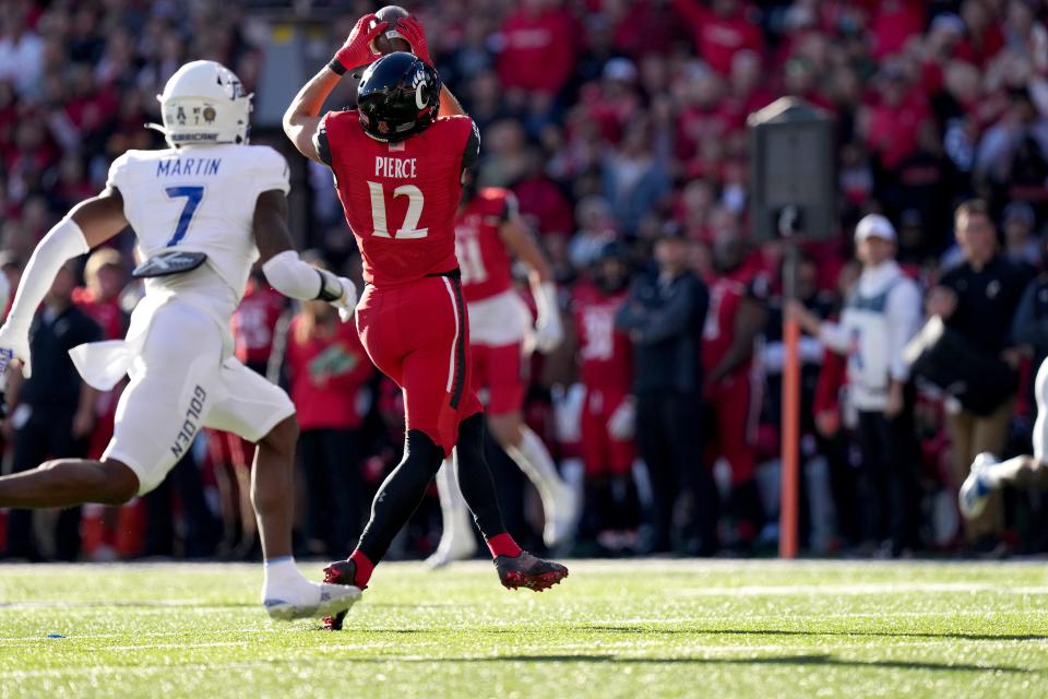 Cincinnati Bearcats wide receiver Alec Pierce (12) catches a pass in the first quarter during an NCAA football game against the Tulsa Golden Hurricane, Saturday, Nov. 6, 2021, at Nippert Stadium in Cincinnati. 