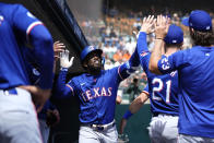 Texas Rangers' Adolis García celebrates his home run against the Detroit Tigers in the third inning of a baseball game, Thursday, April 18, 2024, in Detroit. (AP Photo/Paul Sancya)