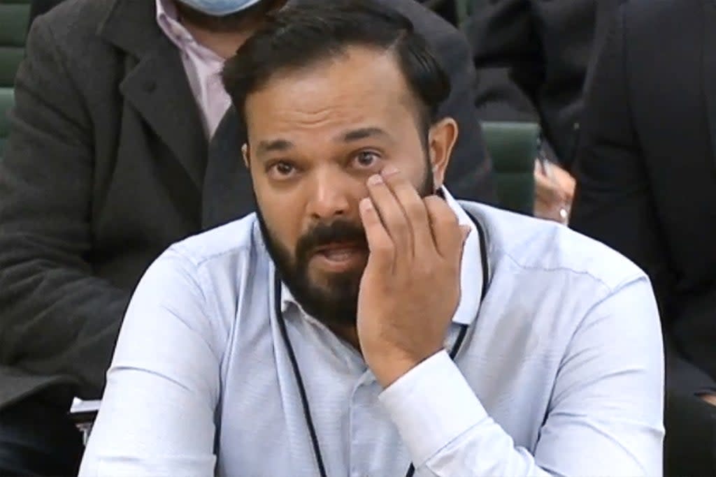 Former Yorkshire cricketer Azeem Rafiq fights back tears while testifying in front of a Digital, Culture, Media and Sport committee in London on Tuesday  (PRU/AFP/Getty)