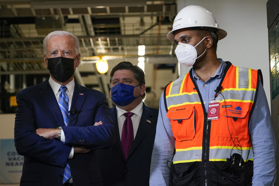 President Joe Biden tours a Clayco Corporation construction site for a Microsoft data center in Elk Grove Village, Ill., Thursday, Oct. 7, 2021, with Illinois Gov. J.B. Pritzker, and Anuraj Jhajj. (AP Photo/Susan Walsh)