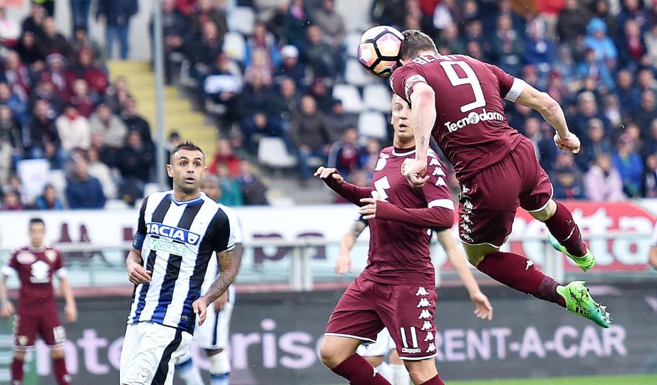 Torino's Andrea Belotti, right, scores with a header during a Serie A soccer match between Torino and Udinese at the Olympic stadium in Turin, Italy, Sunday, April 2, 2017. (Alessandro Di Marco/ANSA via AP)