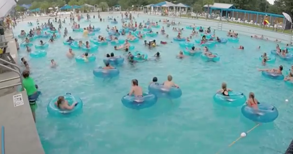 Lifeguard spots drowning child in packed pool (video)