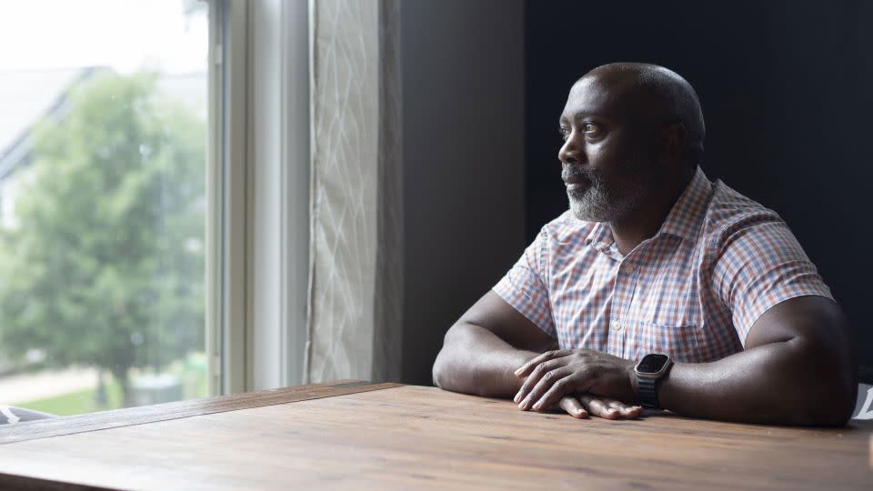 Mutabazi, 49, poses in the kitchen of his Charlotte home. “I’m a girl dad now. Sometimes it feels surreal,” he says. - Sean Mcinnis/The Charlotte Observer/Zuma