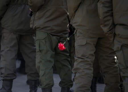 Members of a Ukrainian National Guard battalion named after General Serhiy Kulchytsky take part in a ceremony in honour of the second anniversary of the battalion's creation and to commemorate members killed in the pro-Russian separatist conflict in eastern regions, in Kiev, Ukraine, March 16, 2016. REUTERS/Gleb Garanich