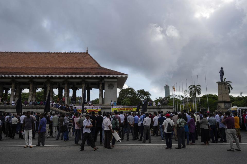 Trade union and civil society activists led by leftists' People Liberation Front gather for a protest in Colombo, Sri Lanka, Tuesday, Aug. 9, 2022. Hundreds of Sri Lankans Tuesday rallied against a government crackdown and the use of emergency laws against those who protested peacefully against the country’s worst economic crisis in recent memory. (AP Photo/Eranga Jayawardena)