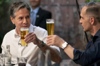 Secretary of State Antony Blinken, left, and German Minister of Foreign Affairs Heiko Maas, right, cheers each other they arrive to speak at a youth outreach event at the Clarchens Ballhaus in Berlin, Thursday, June 24, 2021. Blinken is on a week long trip in Europe traveling to Germany, France and Italy. (AP Photo/Andrew Harnik, Pool)