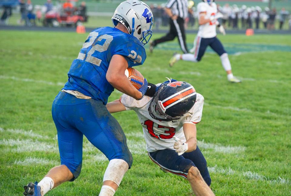 Wynford's Kaiden Blair braces for impact with Galion's Sam Evans.