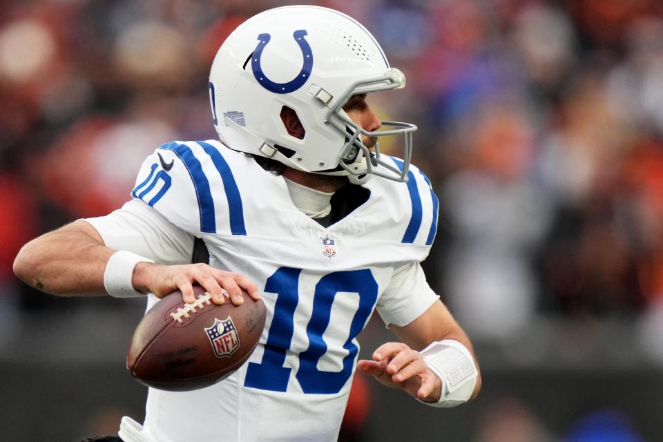 Indianapolis Colts quarterback <a class="link " href="https://sports.yahoo.com/nfl/players/32010" data-i13n="sec:content-canvas;subsec:anchor_text;elm:context_link" data-ylk="slk:Gardner Minshew;sec:content-canvas;subsec:anchor_text;elm:context_link;itc:0">Gardner Minshew</a> (10) roll out of the pocket to throw in the first quarter during a Week 14 NFL game between the Indianapolis Colts and the <a class="link " href="https://sports.yahoo.com/nfl/teams/cincinnati/" data-i13n="sec:content-canvas;subsec:anchor_text;elm:context_link" data-ylk="slk:Cincinnati Bengals;sec:content-canvas;subsec:anchor_text;elm:context_link;itc:0">Cincinnati Bengals</a>, Sunday, Dec. 10, 2023, at Paycor Stadium in Cincinnati.