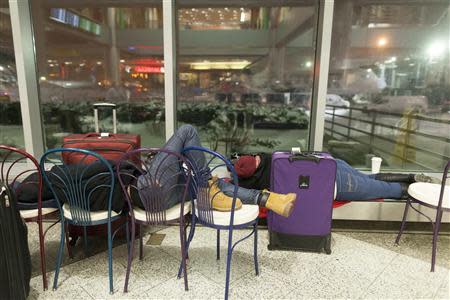 People wait for their delayed flights at LaGuardia Airport in New York January 3, 2014. REUTERS/Zoran Milich