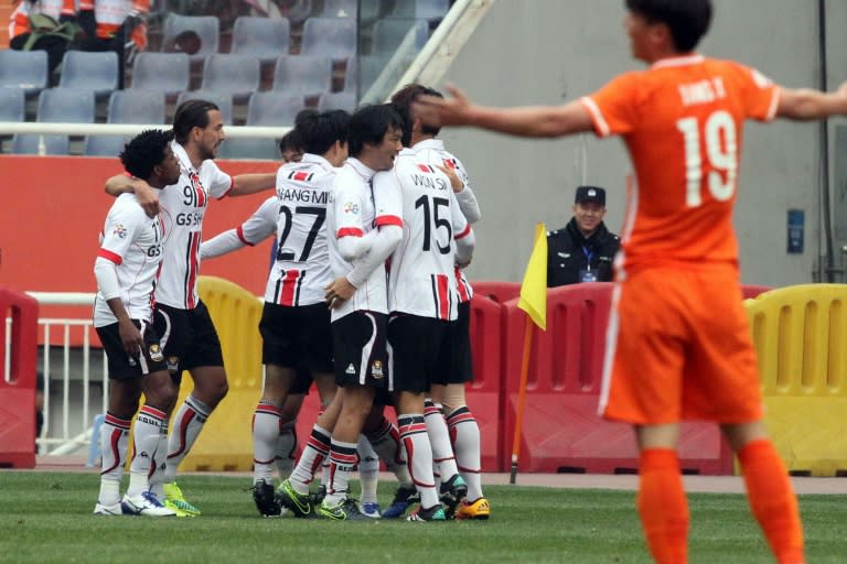 FC Seoul celebrate a goal against China's Shandong Luneng in the AFC Champions League on March 16, 2016