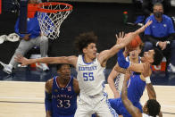Kansas' Jalen Wilson (10) shoots as Kentucky's Lance Ware (55) defends during the first half of an NCAA college basketball game Tuesday, Dec. 1, 2020, in Indianapolis. (AP Photo/Darron Cummings)