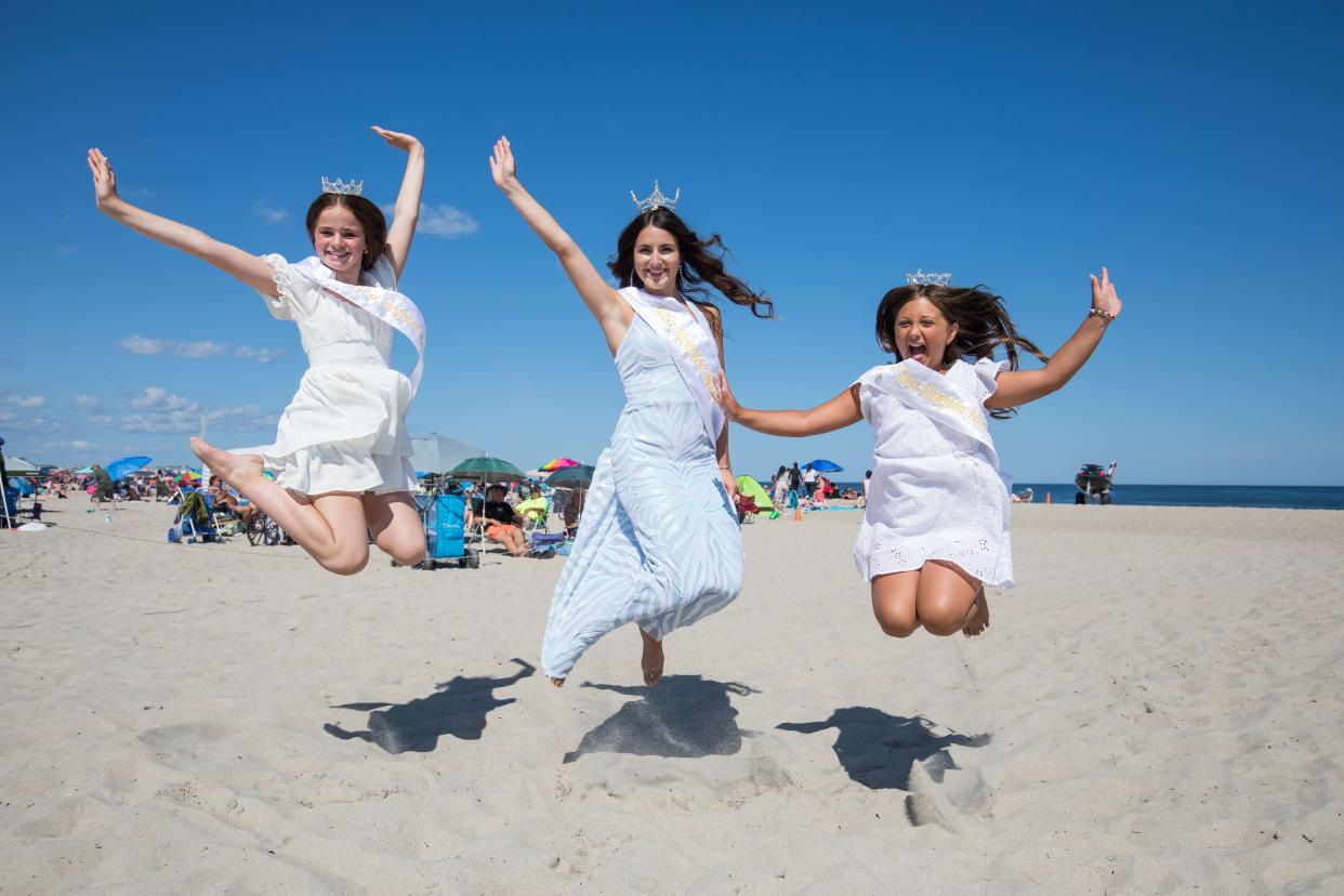 Junior Miss Hampton Beach Kendall Laroche, Miss Hampton Beach 2023 Lexi Brodi, and Little Miss Hampton Beach Braideigh Lynn Heisey on Hampton's sandy beach.