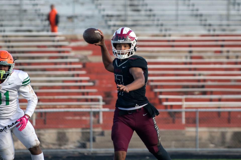 Peoria High quarterback Tino Gist passes the ball during the playoff game against Morgan Park in Peoria Stadium on Saturday, Oct. 30, 2021. The Mustangs beat the Lions 50-42.