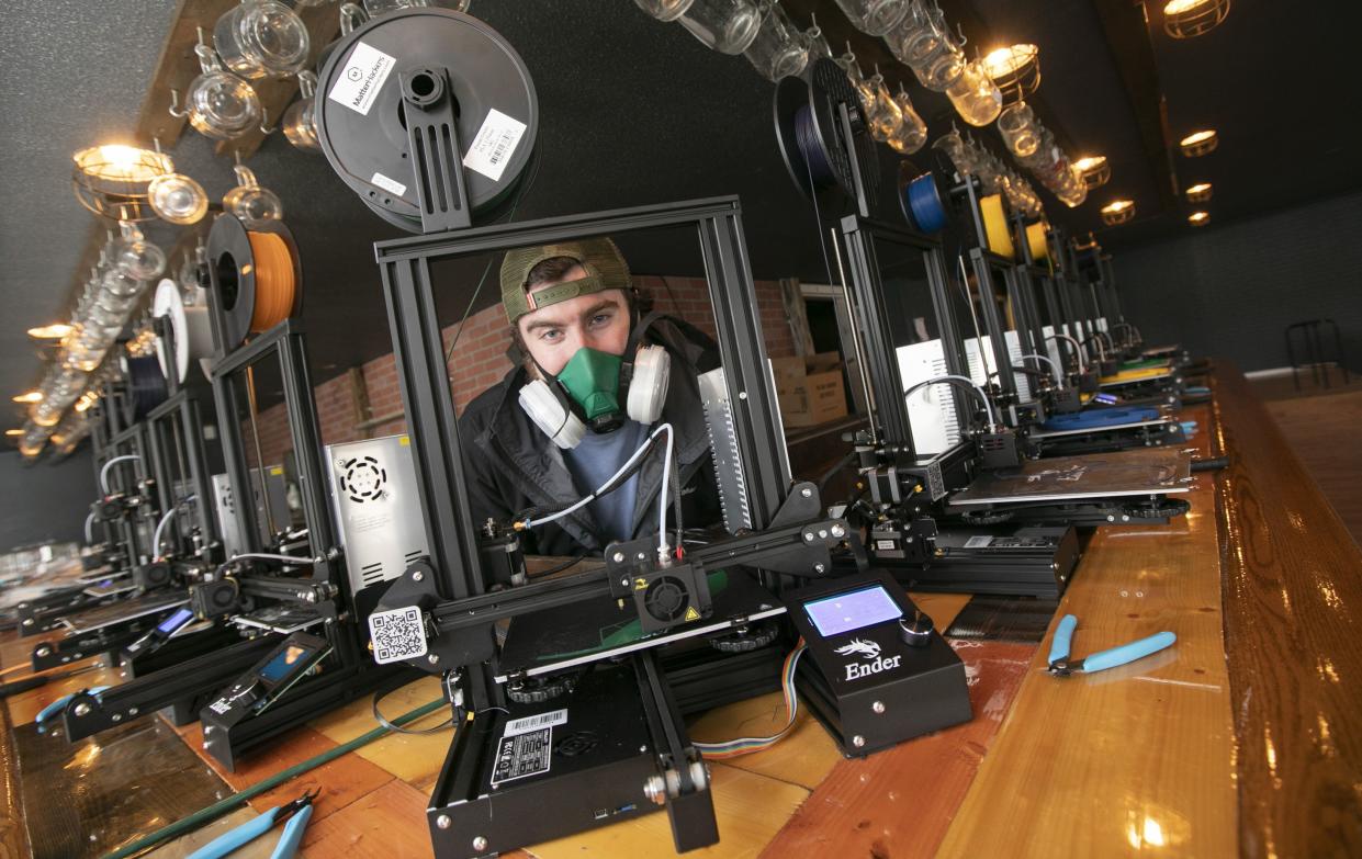 Nikolas Thomson, of Southington, is making 3-D printed face shields and other protective equipment for healthcare workers and first responders on Friday, Apr. 17, 2020, in Southington, Conn. The three have set up shop in the building previously occupied by Hop Knot craft beer and gourmet pretzel bar on Meriden-Waterbury Turnpike in Plantsville.