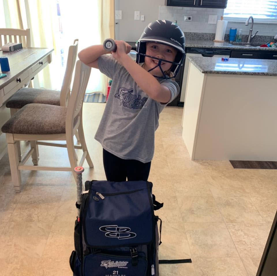 Marie Marcum, 9, currently plays for the Plainfield Twisters, a softball team based out of a Chicago suburb. (Credit: Lisa Marcum)