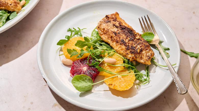 cod and citrus salad on plate