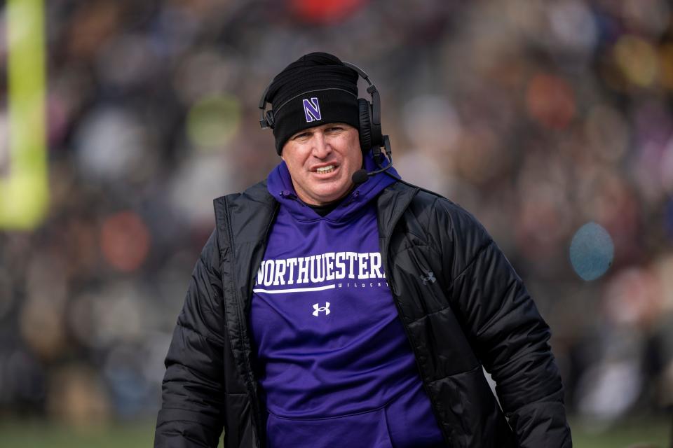 Northwestern football coach Pat Fitzgerald walks the sidelines his team's 2022 game against Purdue at Ross-Ade Stadium.