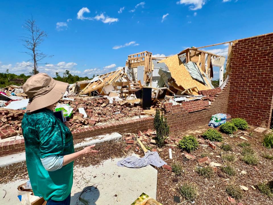 Valerie Bernhart points to the only remaining room in her Blackburn Lane home, the room which she and her husband, John, took shelter to survive Wednesday's storm.