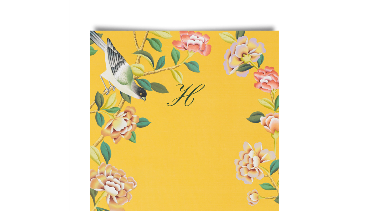 a yellow and white floral wall paper