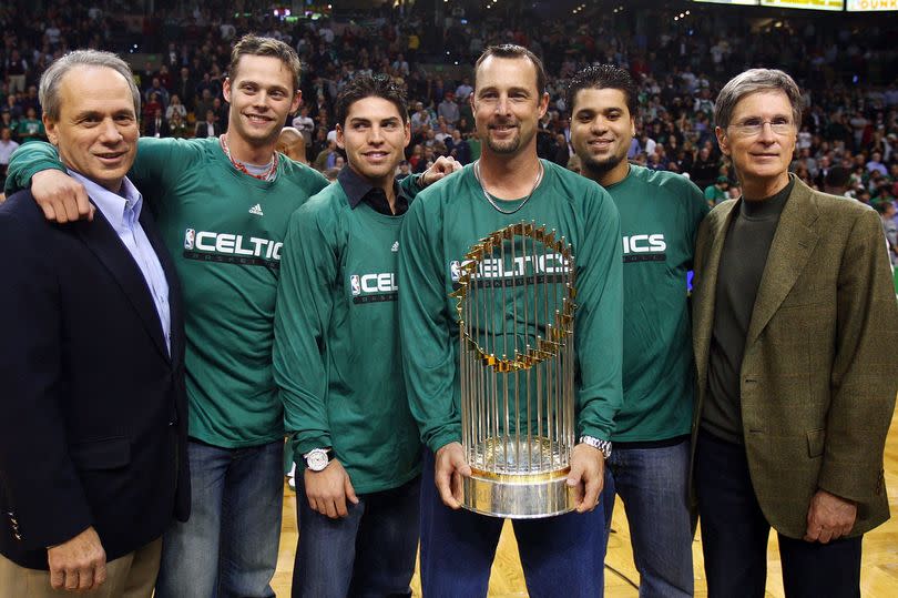 John Henry's connections to the Boston Celtics date back many years, with this photo with the World Series trophy being taken in 2007