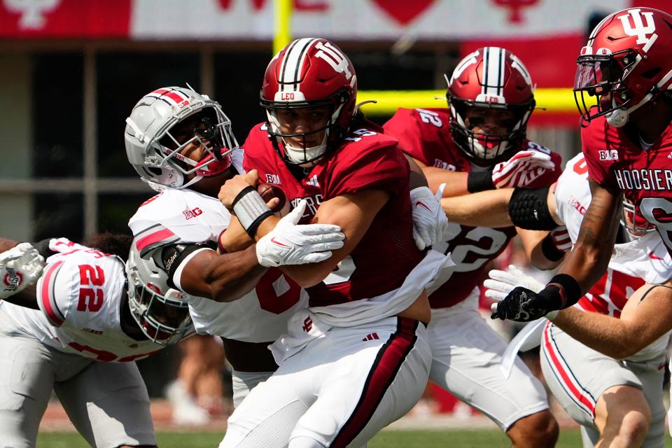 Ohio State safety Sonny Styles tackles Indiana quarterback Brendan Sorsby.