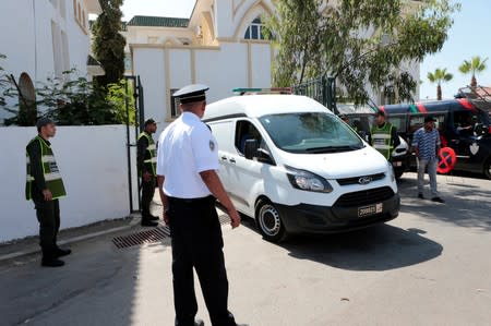 Men, accused in the killing of a Danish and Norwegian hikers in the Atlas mountains near Marrakech last December, are seen inside a car after leaving the courtroom in Sale