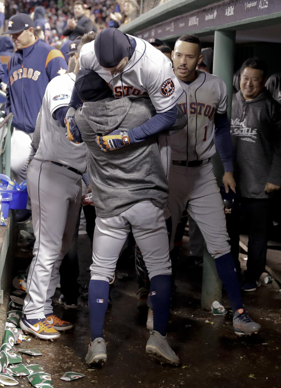 Houston Astros' Josh Reddick celebrates in the dugout after a home run during the ninth inning in Game 1 of a baseball American League Championship Series on Saturday, Oct. 13, 2018, in Boston. (AP Photo/David J. Phillip)