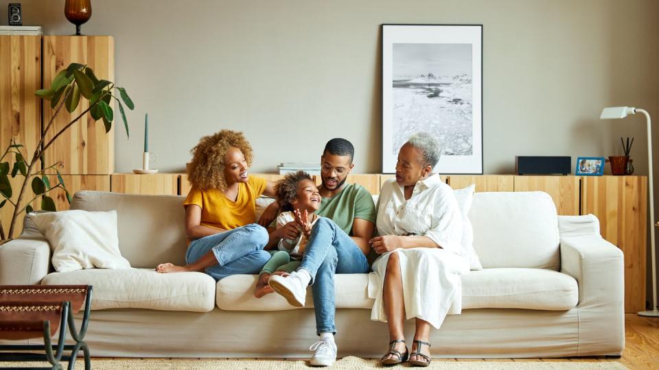 a family sitting on a couch together