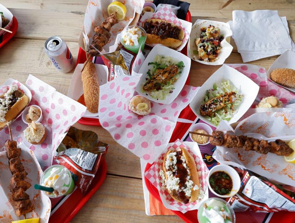 A sampling of food that will be served at the 2022 North Carolina State Fair sits on a table inside Dorton Arena on Monday, Oct. 10, 2022, in Raleigh, N.C.