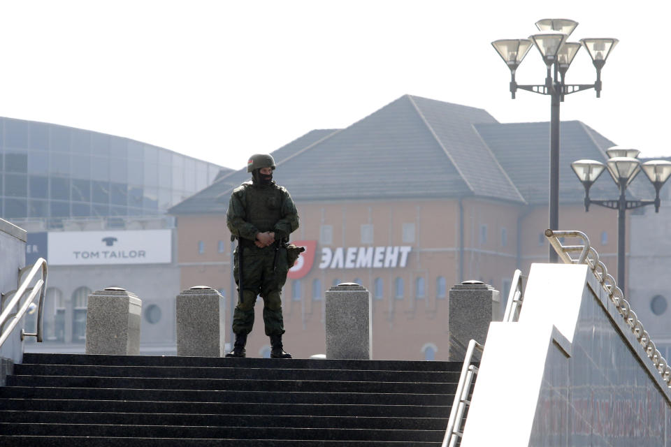 A Belarusian interior ministry soldier guards an empty street to prevent an opposition action to protest the official presidential election results in Minsk, Belarus, Saturday, March 27, 2021. Belarusian opposition has urged people to protest against repressions in the country and Lukashenko's regime. (BelaPan via AP)