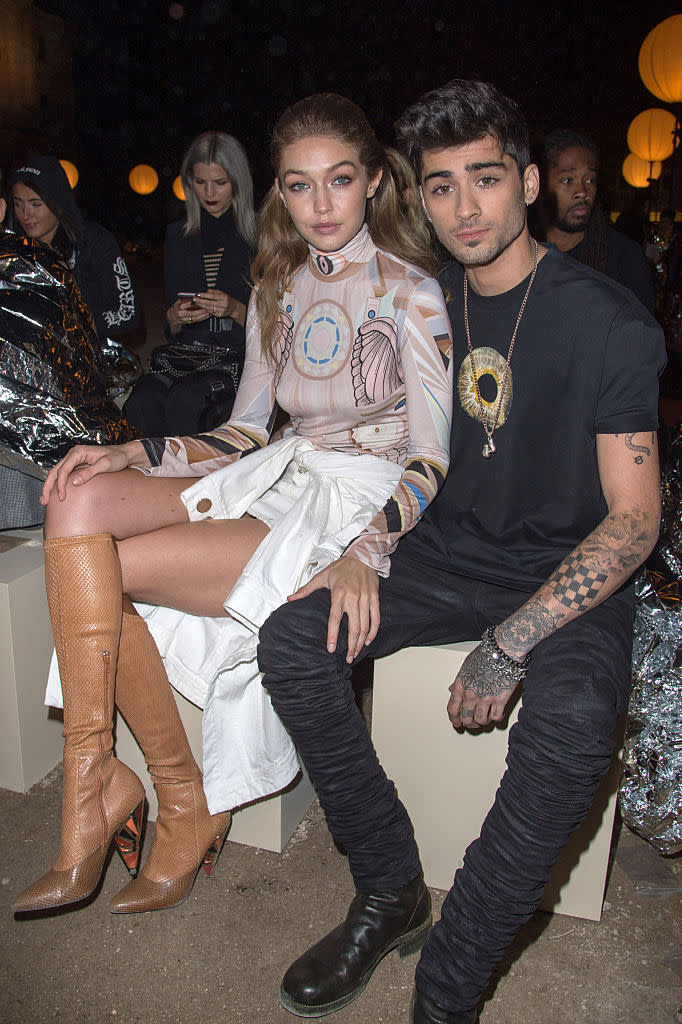 Gigi Hadid and Zayn Malik attend the Givenchy show at Paris Fashion Week in October 2016. (Photo: Stephane Cardinale – Corbis/Corbis via Getty Images)