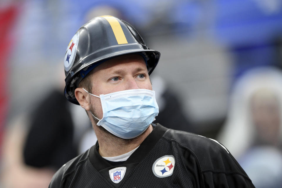 A spectator wears a face mask to protect against COVID-19 during the second half of an NFL football game between the Baltimore Ravens and the Pittsburgh Steelers, Sunday, Nov. 1, 2020, in Baltimore. The Steelers won 28-24. (AP Photo/Nick Wass)