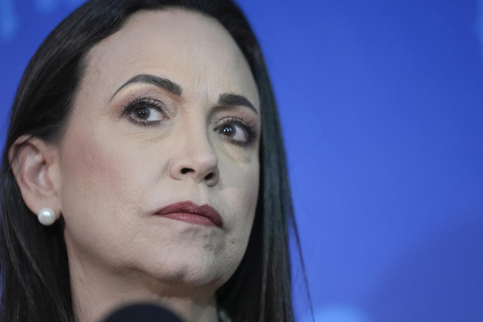 FILE - Opposition presidential hopeful Maria Corina Machado pauses during a press conference at her campaign headquarters, in Caracas, Venezuela, Dec. 15, 2023. As a March 25, 2024 deadline nears to register to compete in the presidential election, Machado faces pressure from foreign leaders and fellow government opponents to abandon her dead-end candidacy, because she’s technically barred from office. (AP Photo/Matias Delacroix, File)