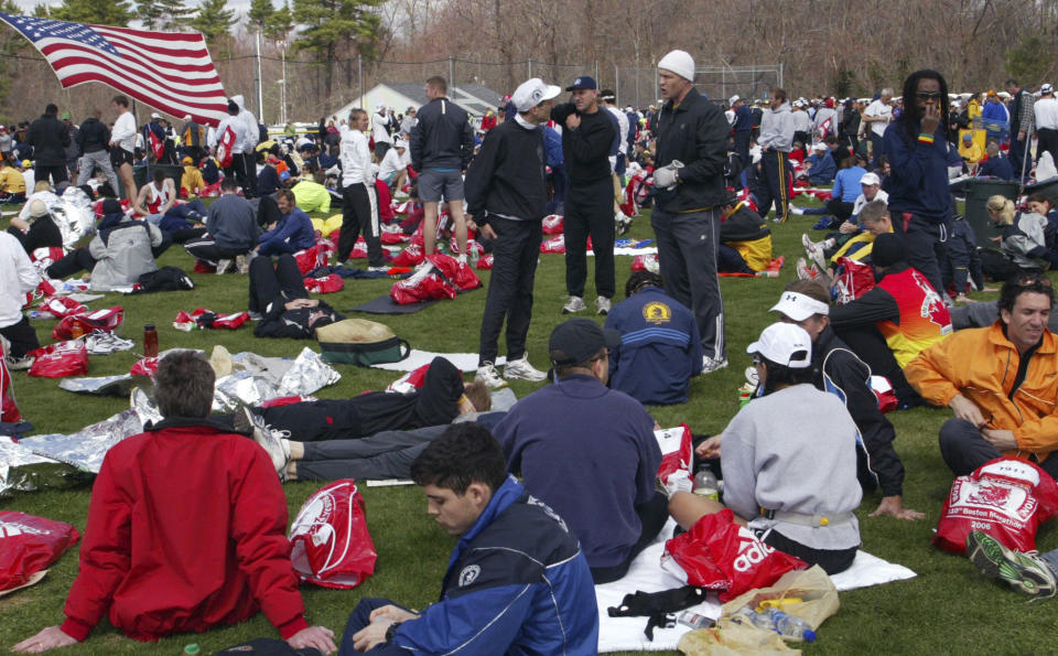 FILE - Runners rest up in the Hopkinton, Mass., Athletes' Village, Monday, April 17, 2006, before the start of the 110th Boston Marathon. Once a year for the last 100 years, Hopkinton becomes the center of the running world, thanks to a quirk of geography and history that made it the starting line for the world's oldest and most prestigious annual marathon. (AP Photo/Bizuayehu Tesfaye, File)
