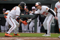 Baltimore Orioles' Gunnar Henderson (2) celebrates his home run with Adley Rutschman (35) during the first inning of a baseball game against the Minnesota Twins, Wednesday, April 17, 2024, in Baltimore. The Orioles won 4-2. (AP Photo/Jess Rapfogel)