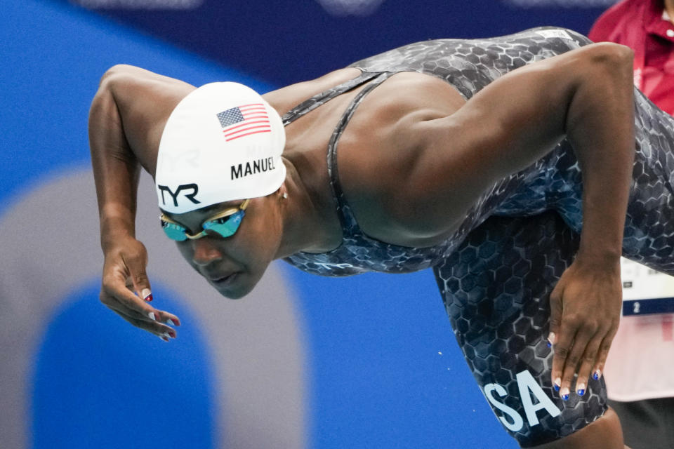 FILE - Simone Manuel, of United States, swims in a women's 50-meter freestyle heat at the 2020 Summer Olympics, Friday, July 30, 2021, in Tokyo, Japan. The Soul Cap has gotten the green light from swimming's top governing body, which figures to be a huge step toward bringing more diversity to a largely white sport. The oversized cap, which is designed to make it more comfortable for Black swimmers to hit the water with natural hair, will likely have its biggest influence at the grassroots level. That, in turn, could lead to more swimmers of color reaching the sport's highest echelons in the generations to come. (AP Photo/Gregory Bull, File)