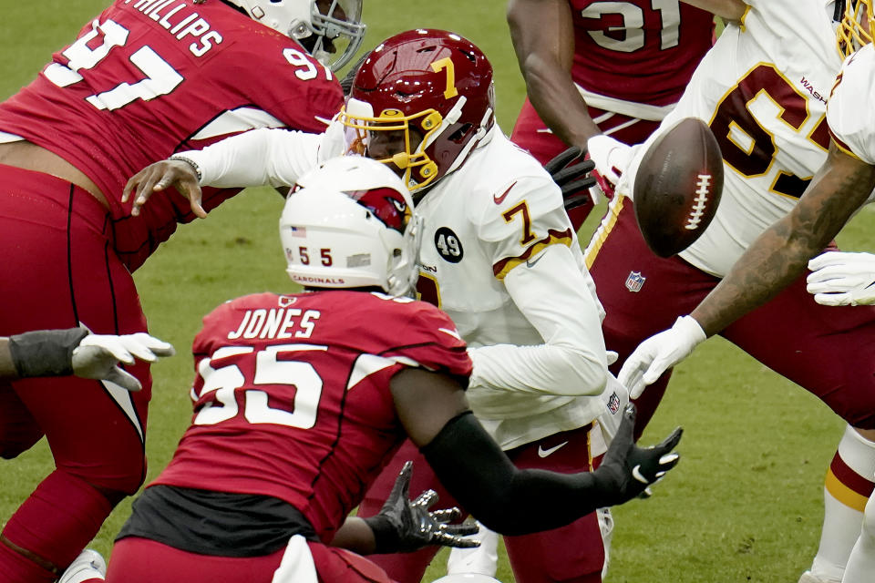 Arizona Cardinals linebacker Chandler Jones (55) recovers a fumble by Washington Football Team quarterback Dwayne Haskins (7) during the first half of an NFL football game, Sunday, Sept. 20, 2020, in Glendale, Ariz. (AP Photo/Ross D. Franklin)