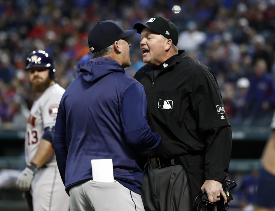 Houston Astros manager AJ Hinch argues with umpire Jeanmar Gomez, right, during the second inning of the team's baseball game against the Texas Rangers in Arlington, Texas, Wednesday, April 3, 2019. Hinch was ejected during the argument. (AP Photo/Tony Gutierrez)