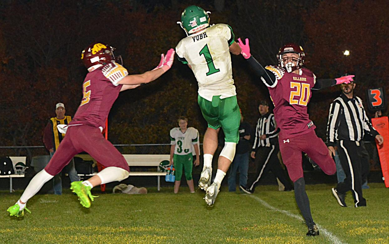 De Smet's Tom Aughenbaugh (4) and Slayten Wilkinson (20) attempt to break up a pass intended for Colome's Eli Vobr during their first-round state Class 9B high school football playoff game on Thursday, Oct. 19, 2023 at De Smet.