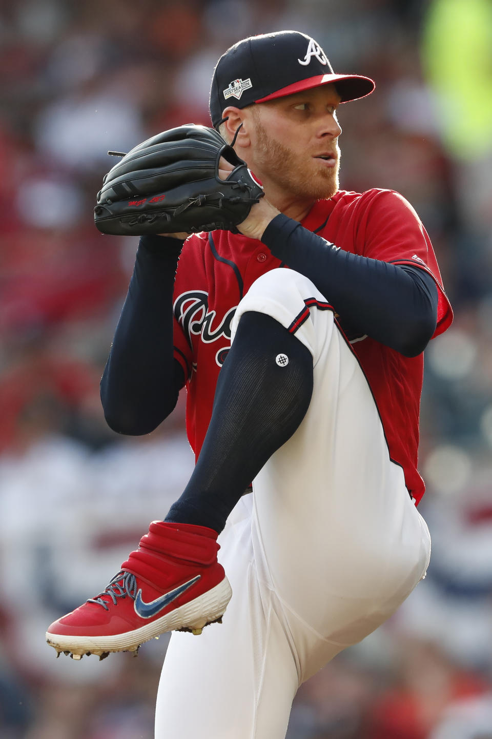 Atlanta Braves starting pitcher Mike Foltynewicz (26) works in the fifth inning during Game 2 of a best-of-five National League Division Series, Friday, Oct. 4, 2019, in Atlanta. (AP Photo/John Bazemore)