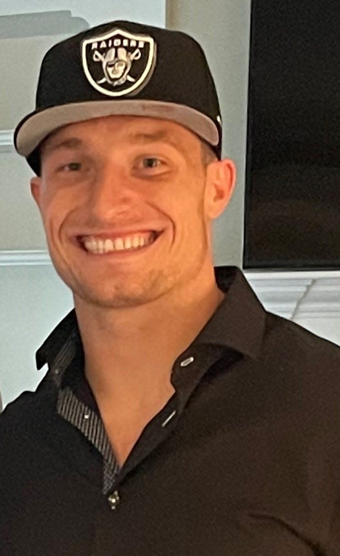University of New Hampshire football standout Dylan Laube proudly wears a Las Vegas Raiders hat after being drafted by the AFC West team in the sixth round of last Saturday's NFL Draft.