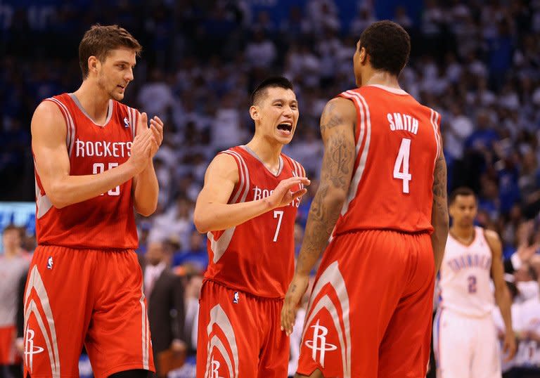 The Houston Rockets' (L-R) Chandler Parsons, Jeremy Lin and Greg Smith are pictured during their game against Oklahoma City on April 24, 2013. The Thunder squandered a 15-point lead in the fourth quarter as Houston rallied with a 21-2 run for four-point lead in the late going