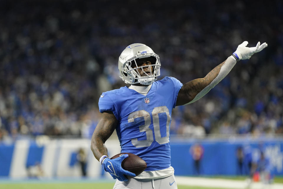 Detroit Lions running back Jamaal Williams looks towards the fans after his 2-yard touchdown run during the second half of an NFL football game against the Chicago Bears, Sunday, Jan. 1, 2023, in Detroit. (AP Photo/Paul Sancya)
