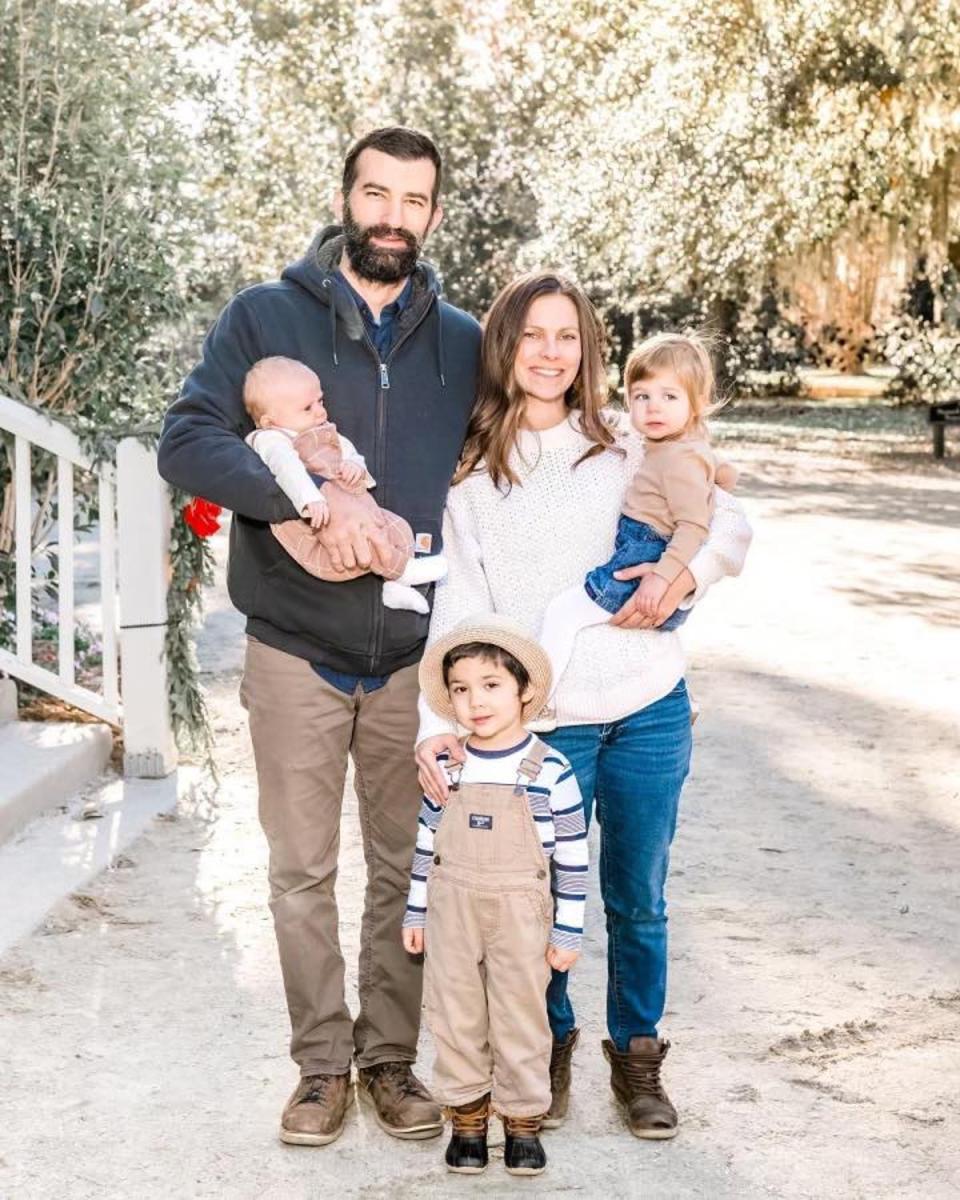 Jim Shiels and fiancee Katie Seley, with their three children. Seley died in flash flooding in Pennsylvania on Saturday, and Matilda Sheils, two, (right) and nine-month-old Conrad Sheils, are still missing (Upper Makefield Township Police Department)