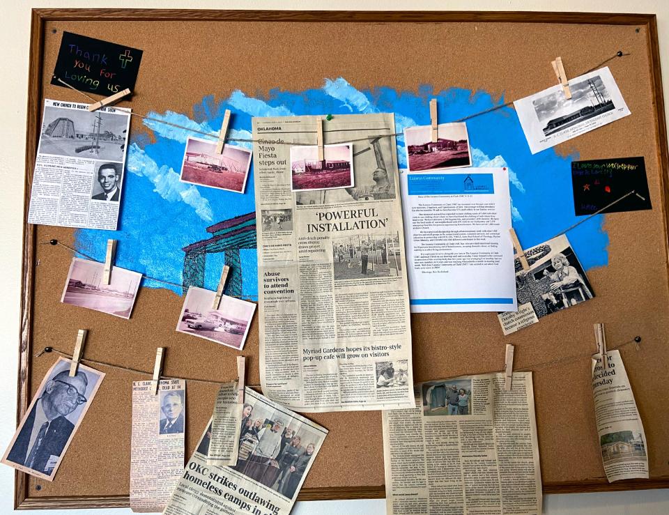 A bulletin board featuring vintage photos, church bulletins and newspaper clippings is displayed at the Clark Memorial United Methodist Church deconsecration service.