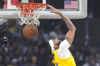 Los Angeles Lakers forward Anthony Davis dunks during the first half of an NBA basketball game against the Los Angeles Clippers on Wednesday, Feb. 28, 2024, in Los Angeles. (AP Photo/Mark J. Terrill)
