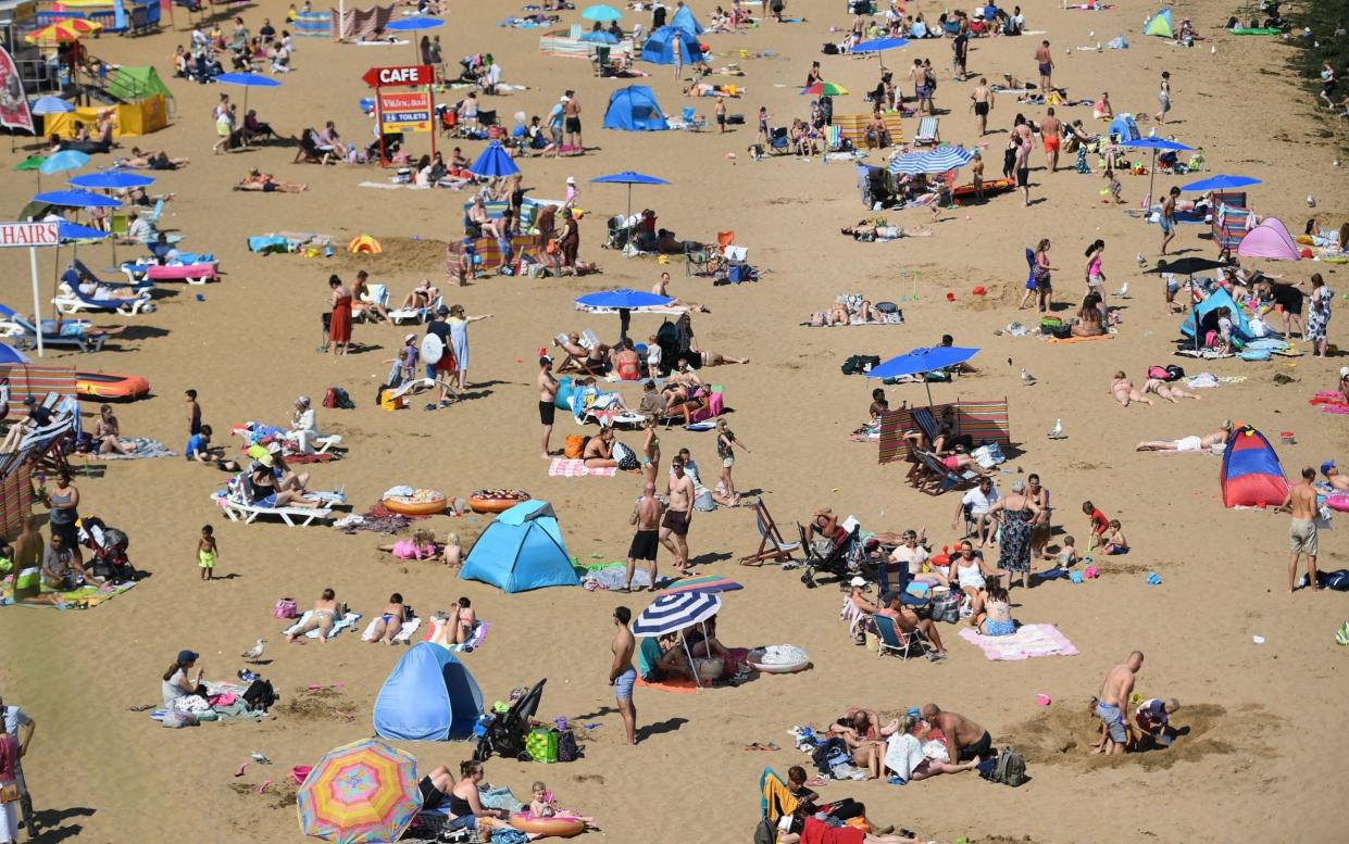 Holidaymakers soak up sun at Broadstairs, Kent. Many people are booking their summer or autumn breaks in the UK - Andy Rain/EPA-EFE/Shutterstock