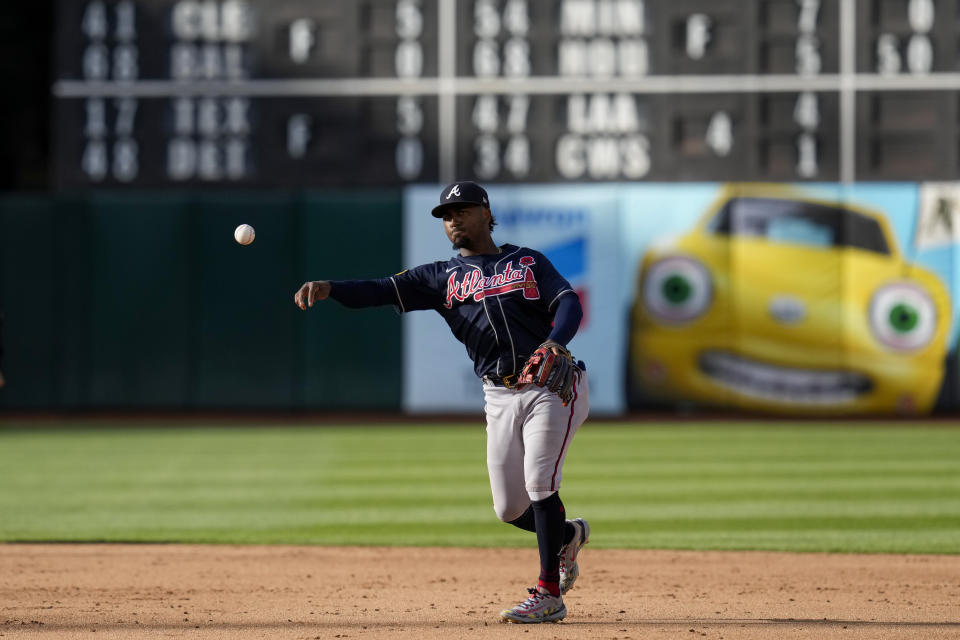 Atlanta Braves second baseman Ozzie Albies throws to first for an out against Oakland Athletics' Seth Brown during the fifth inning of a baseball game in Oakland, Calif., Monday, May 29, 2023. (AP Photo/Godofredo A. Vásquez)