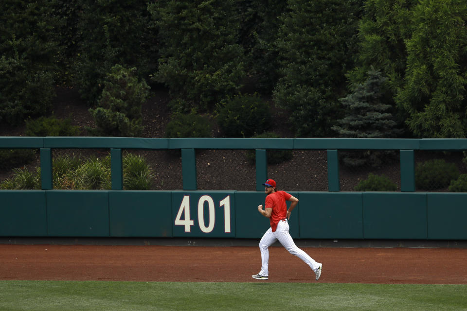 Philadelphia Phillies' Aaron Nola jogs the outfield during baseball practice at Citizens Bank Park, Monday, July 6, 2020, in Philadelphia. (AP Photo/Matt Slocum)